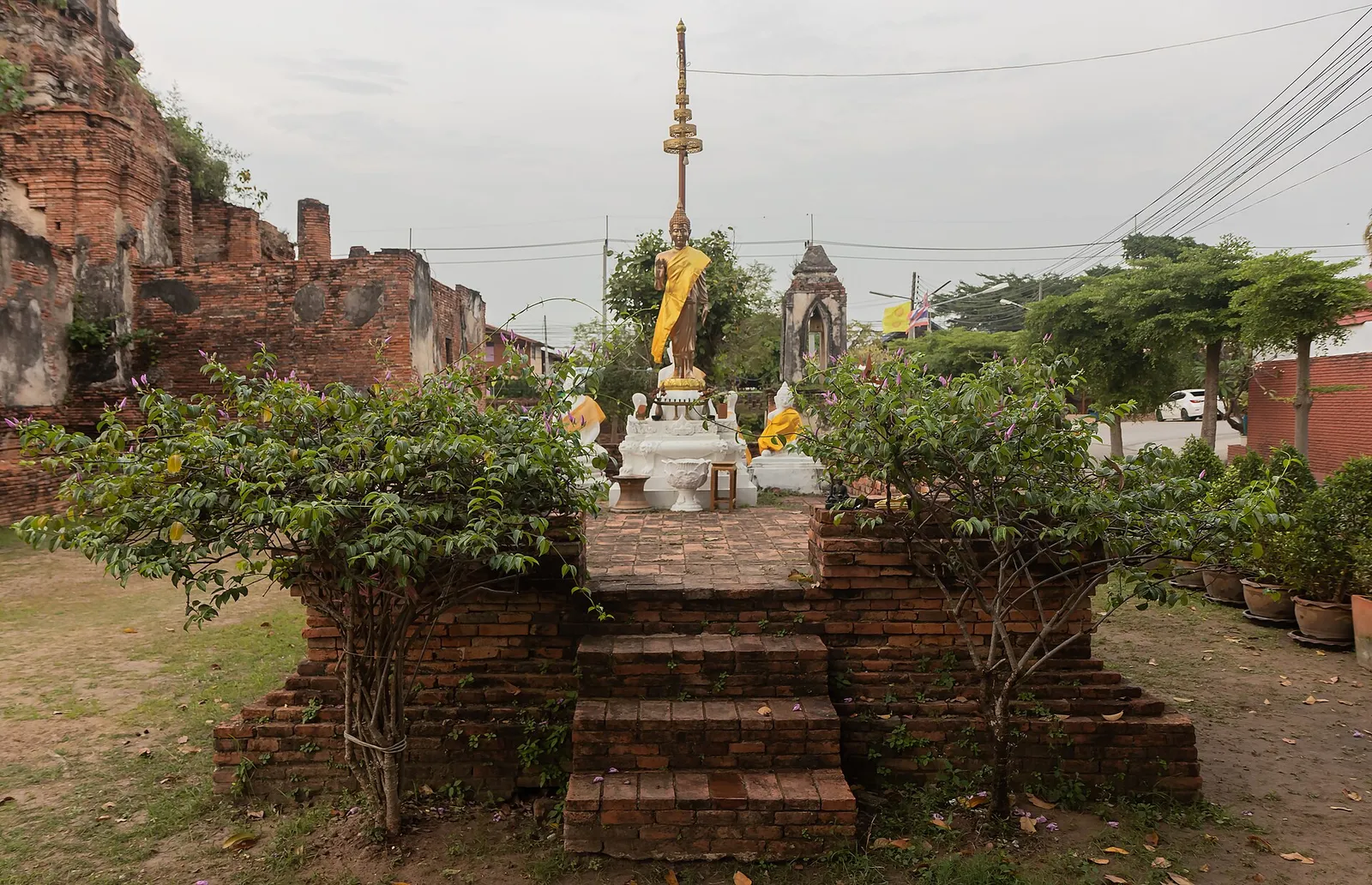 Brick temple ruins and a row of chedis at Ayutthaya, Thailand