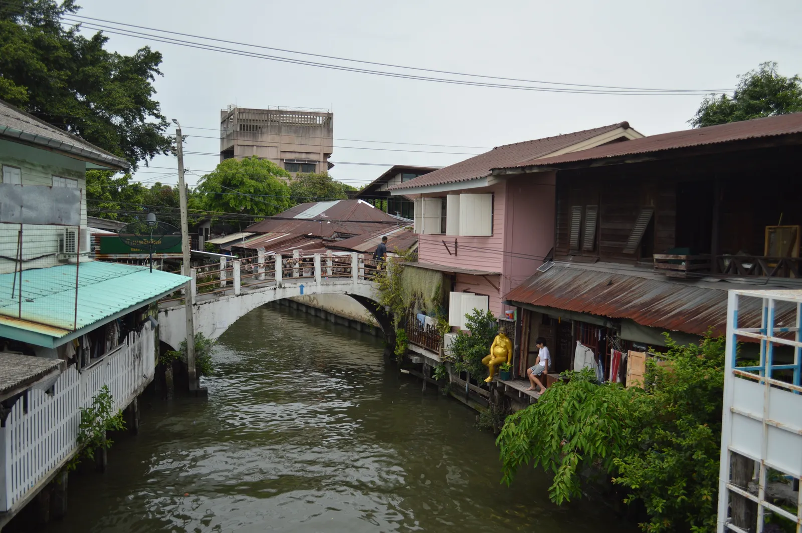 Wooden houses lining a narrow canal