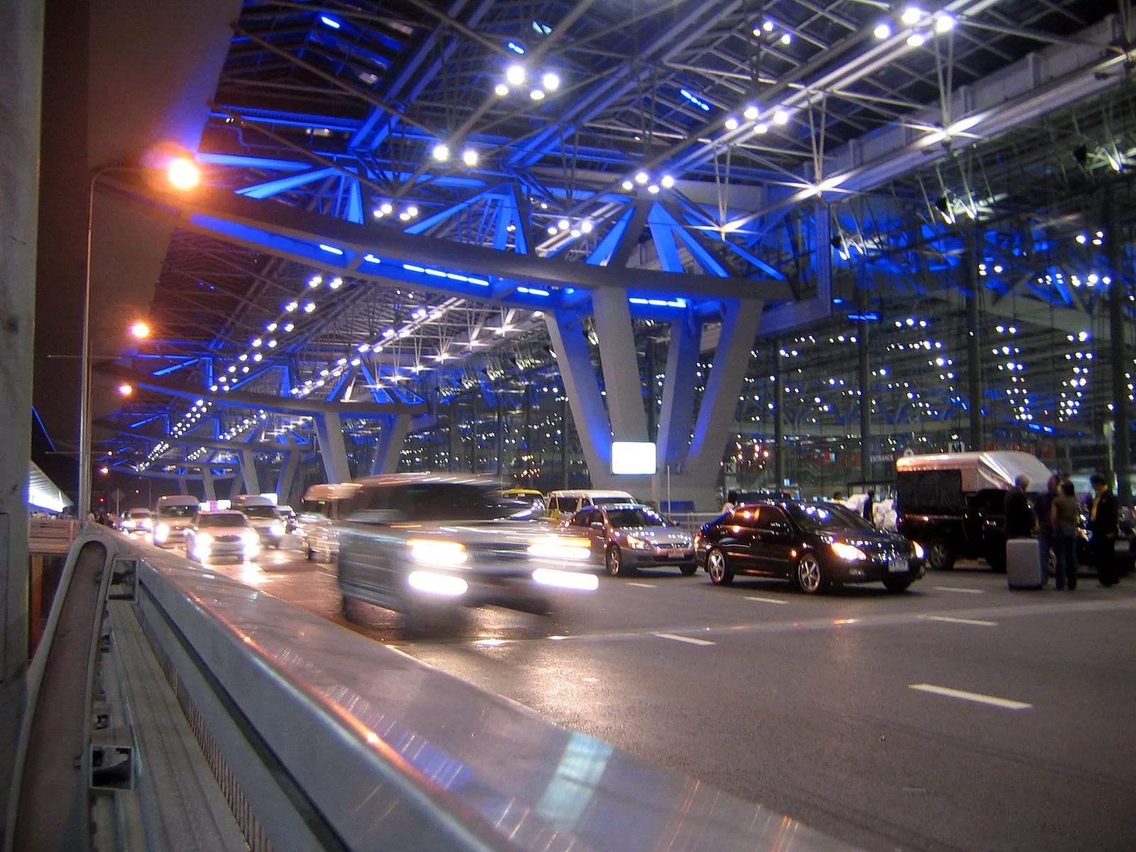 The sweeping modern terminal architecture of Suvarnabhumi Airport in Bangkok, Thailand in daylight