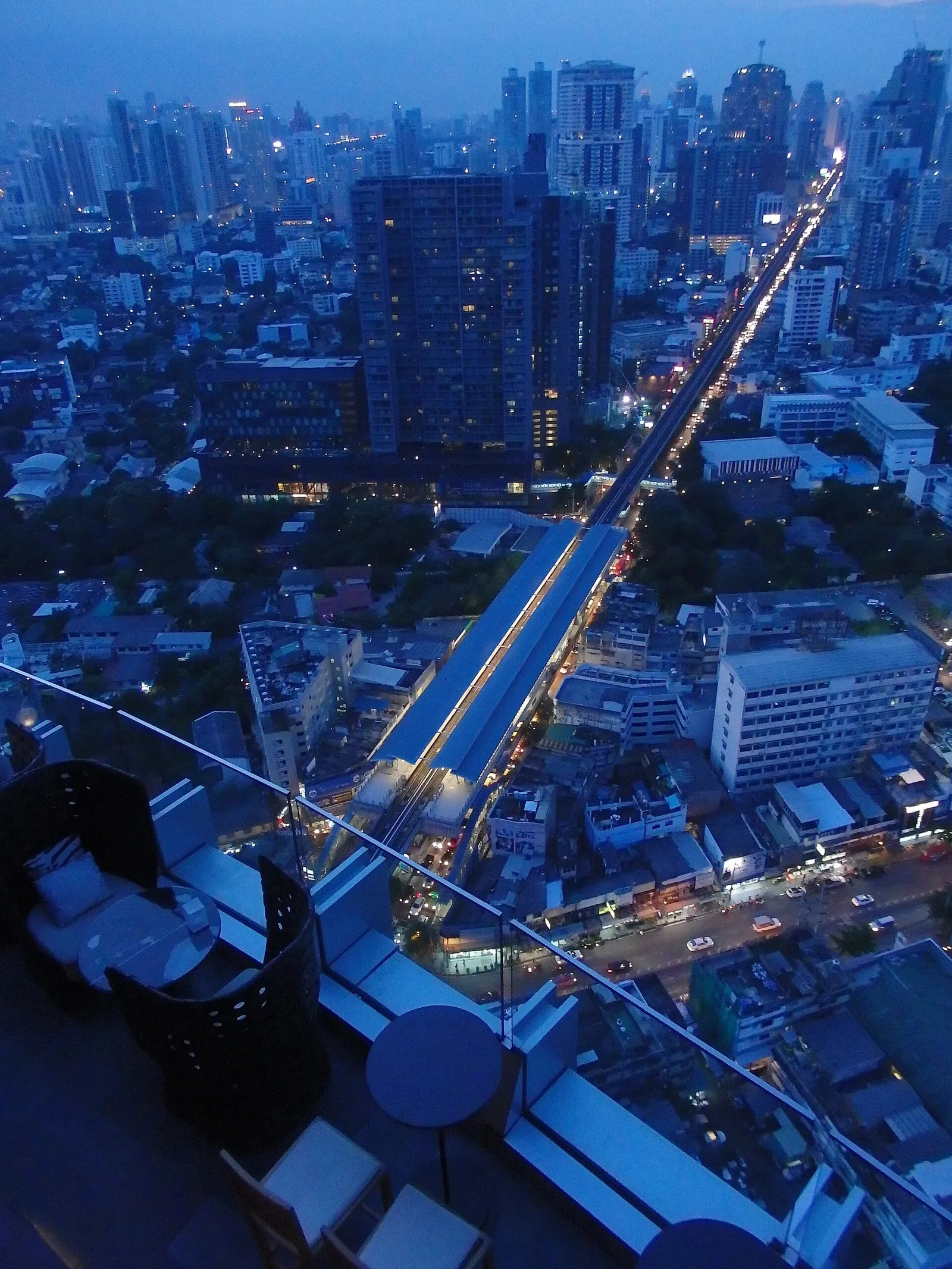 A busy night market with food stalls and lights in Bangkok, Thailand