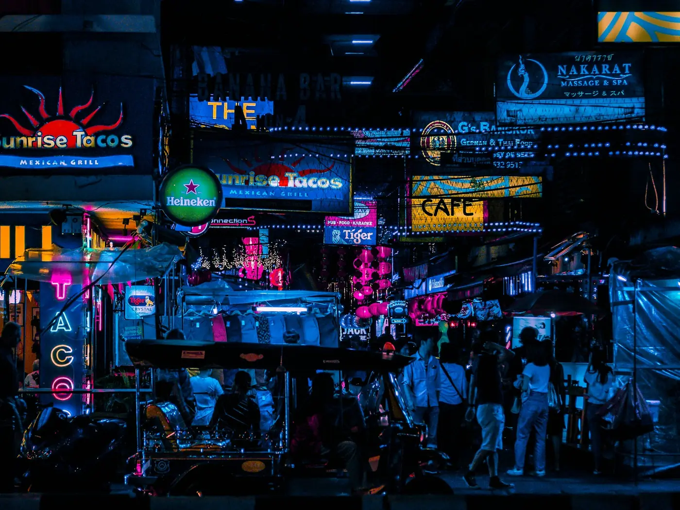 Bar stalls and live music at an outdoor night venue in Bangkok, Thailand