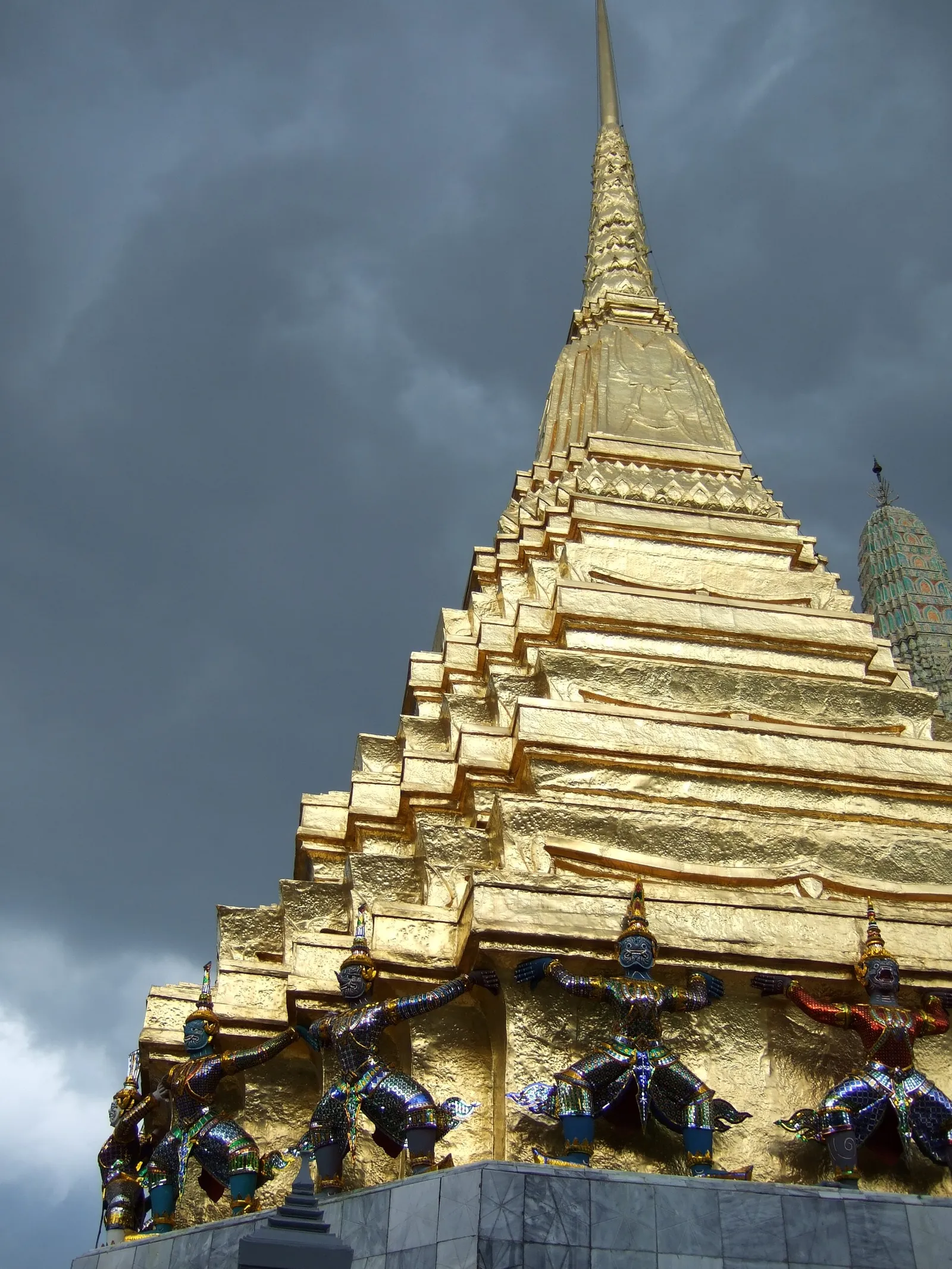 Golden stupas and ornate spires inside the Grand Palace complex in Bangkok, Thailand