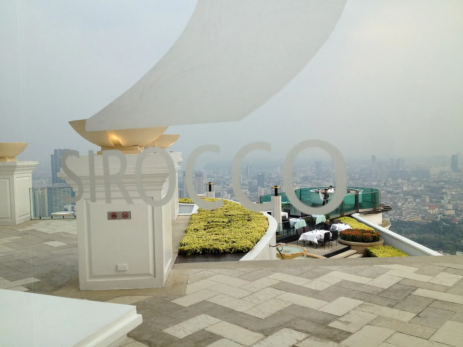 A rooftop restaurant terrace above the city in Bangkok, Thailand