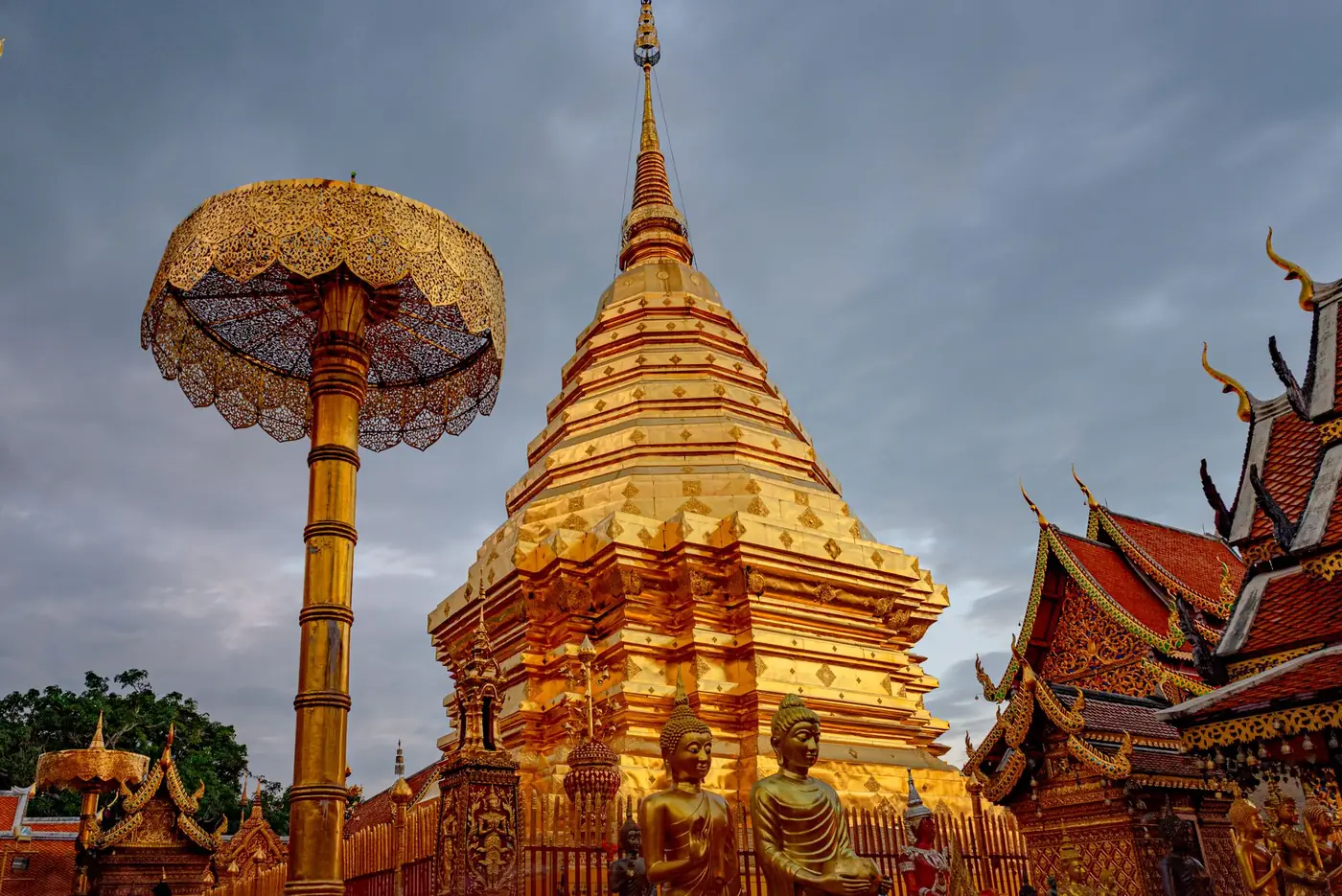 The golden chedi and umbrellas at the temple on Doi Suthep above Chiang Mai, Thailand