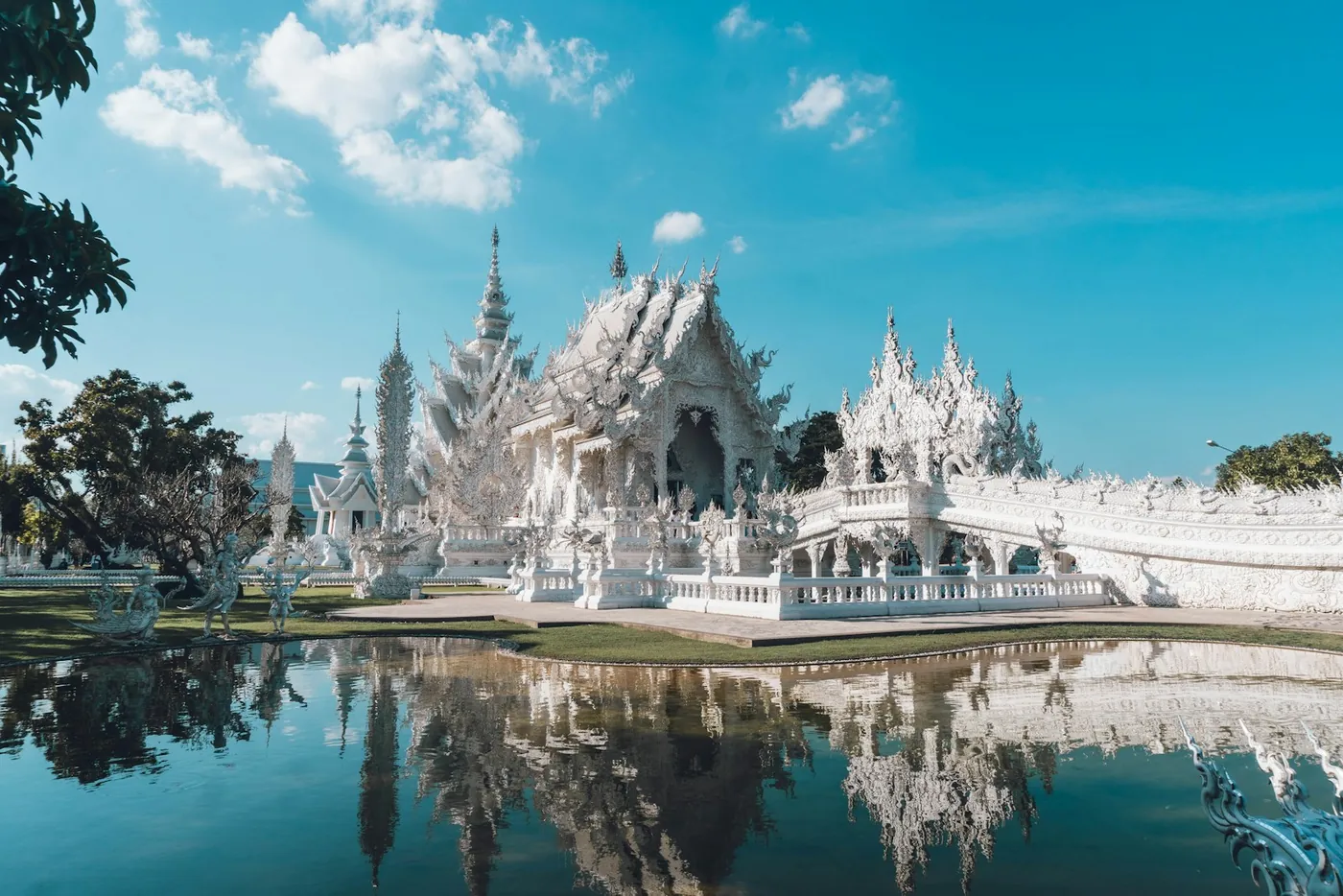 The all-white temple complex with mirrored decoration at Chiang Rai, Thailand