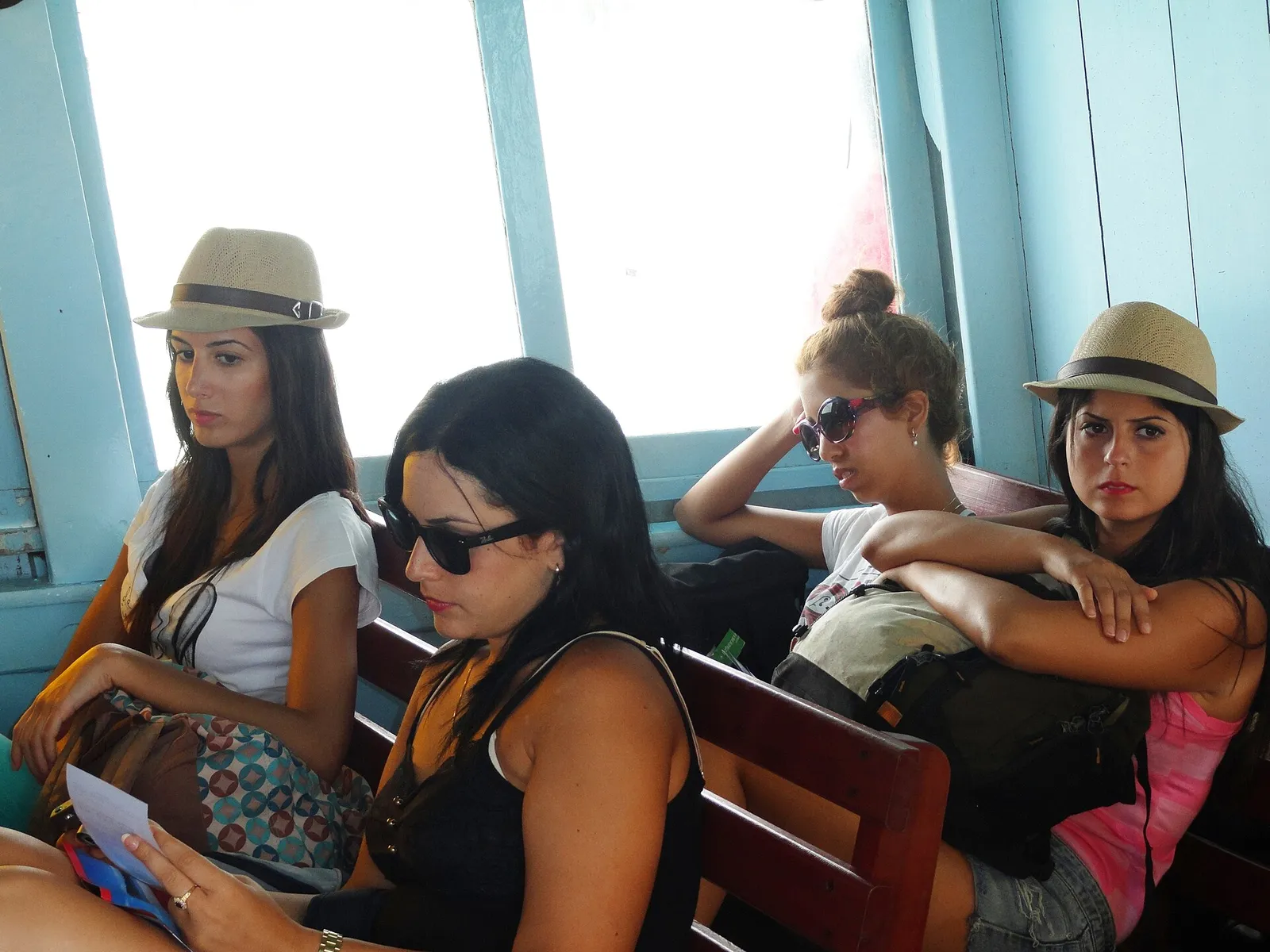 Passengers sitting on board a ferry between the Thai islands