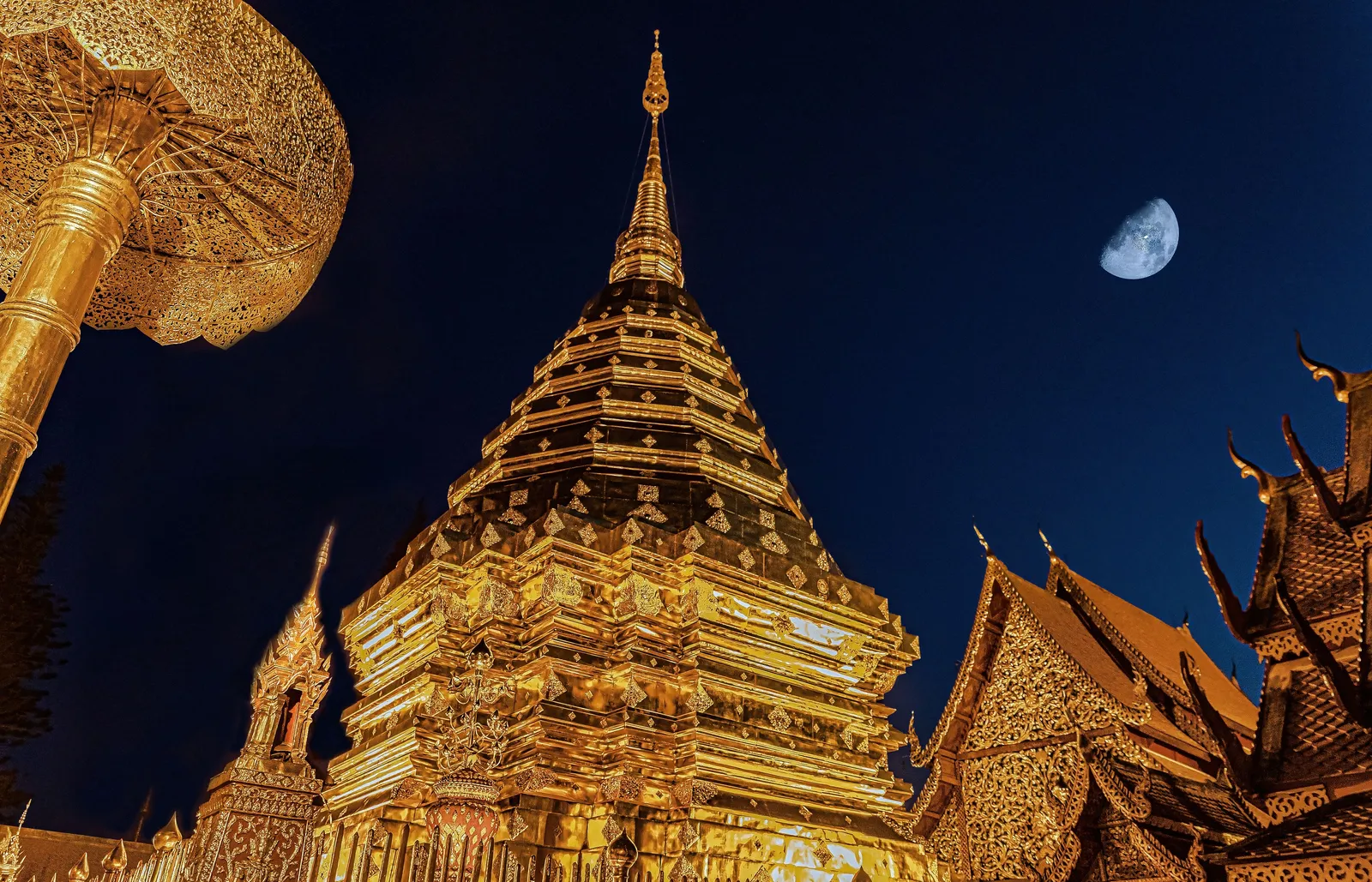 Golden temple spires and a red-and-gold roofline inside Chiang Mai's old city walls