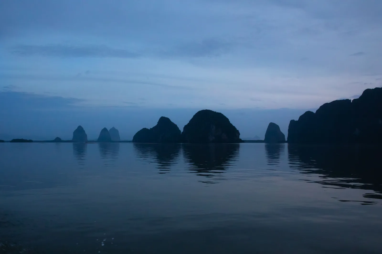 Limestone karst islands rising from turquoise water in Phang Nga Bay off Phuket