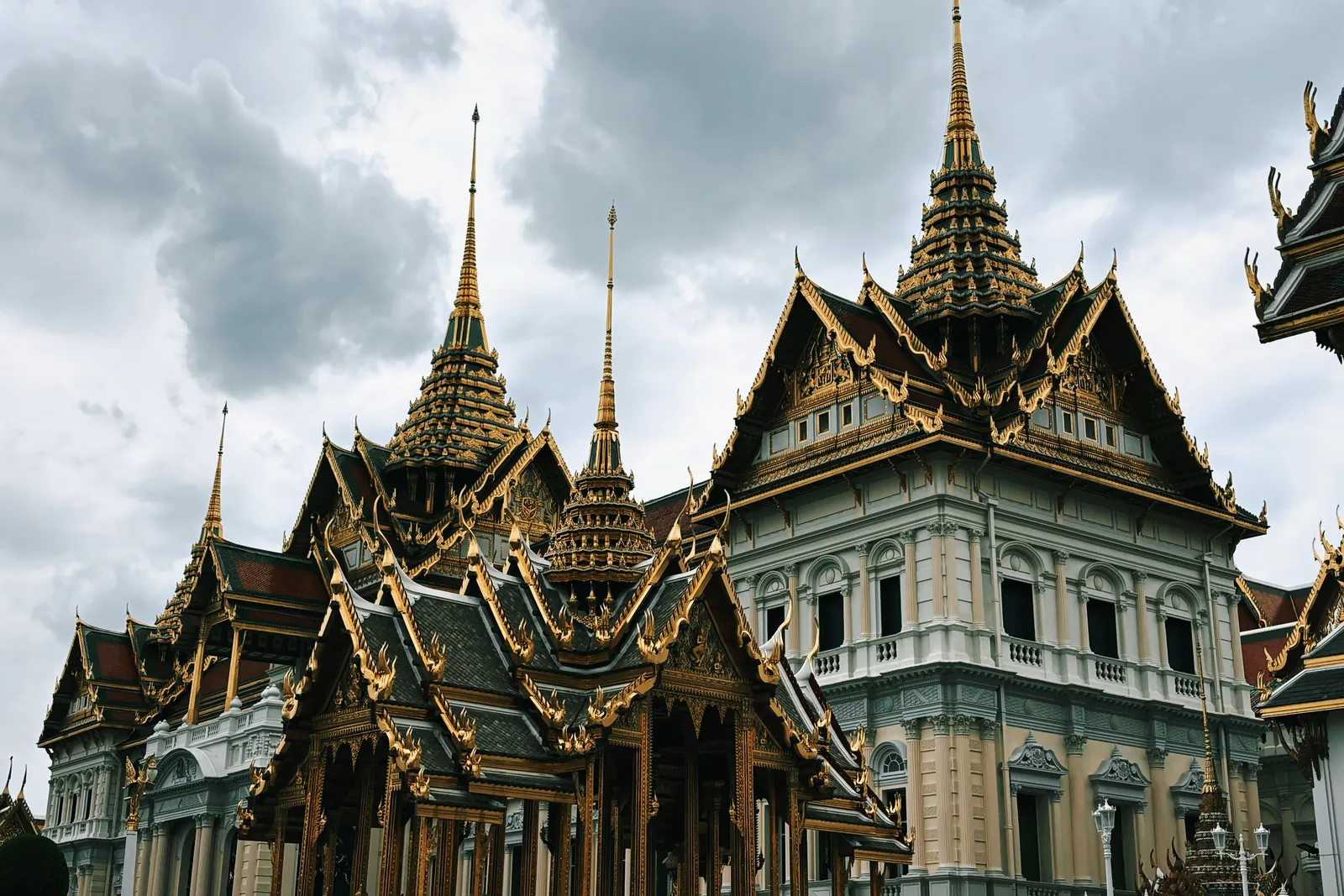 The gilded spires and mosaic decoration of the Grand Palace complex in Bangkok