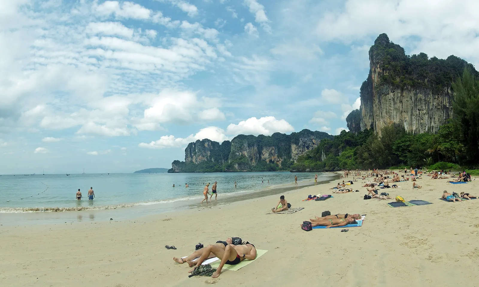 Turquoise water and towering limestone karst cliffs at Railay on the Andaman coast of Thailand
