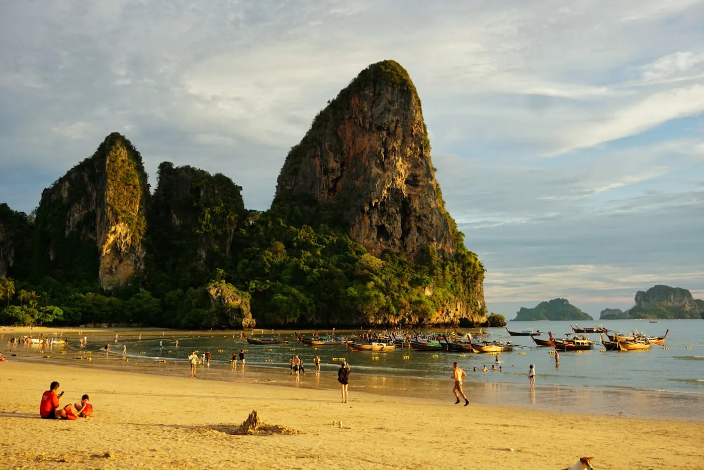 Limestone towers rising from the sea beside the beach at Railay, Thailand