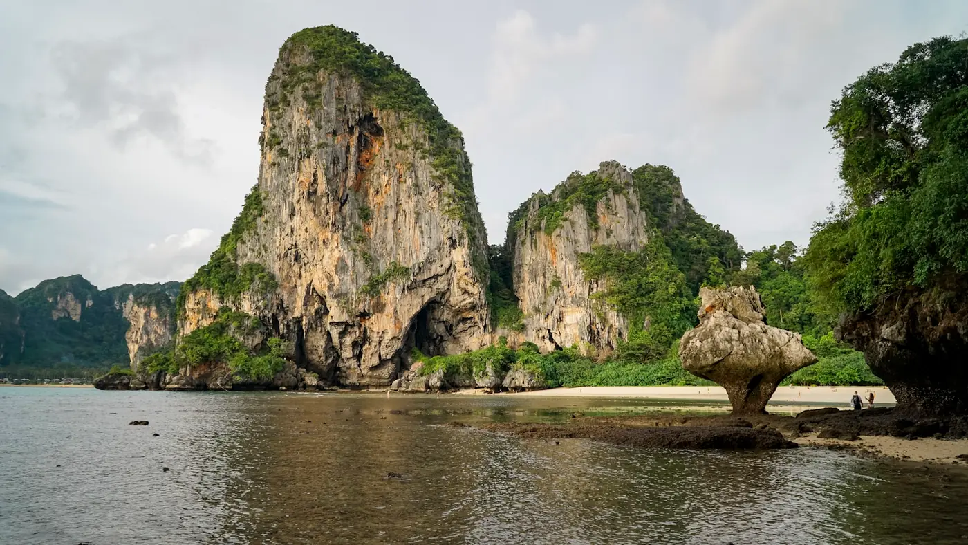 Limestone karst cliffs above calm green water near Krabi, Thailand