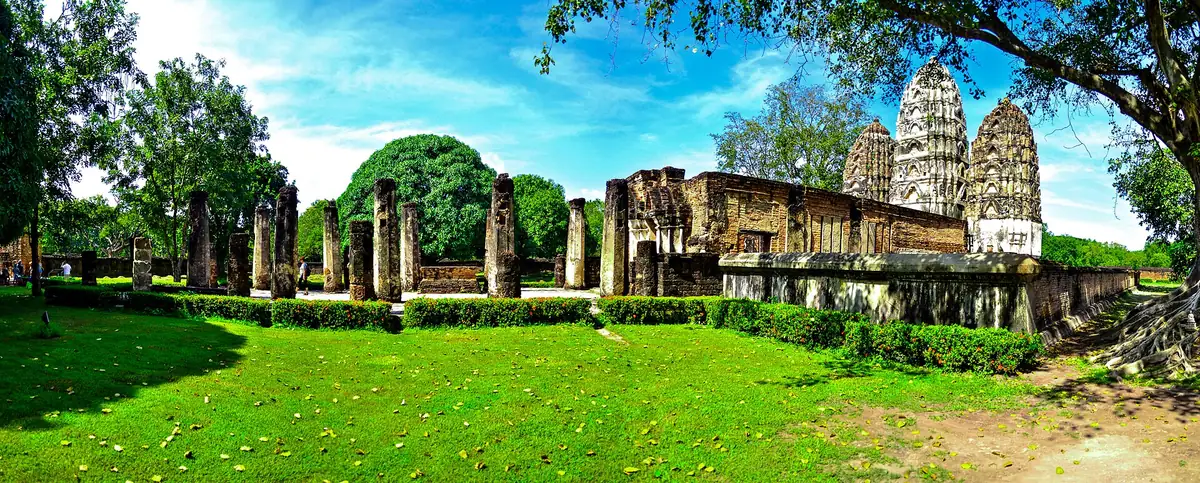 The three towers of Wat Si Sawai in Sukhothai on the lawn