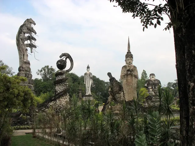 Giant concrete sculptures including a many headed serpent rising above a seated figure