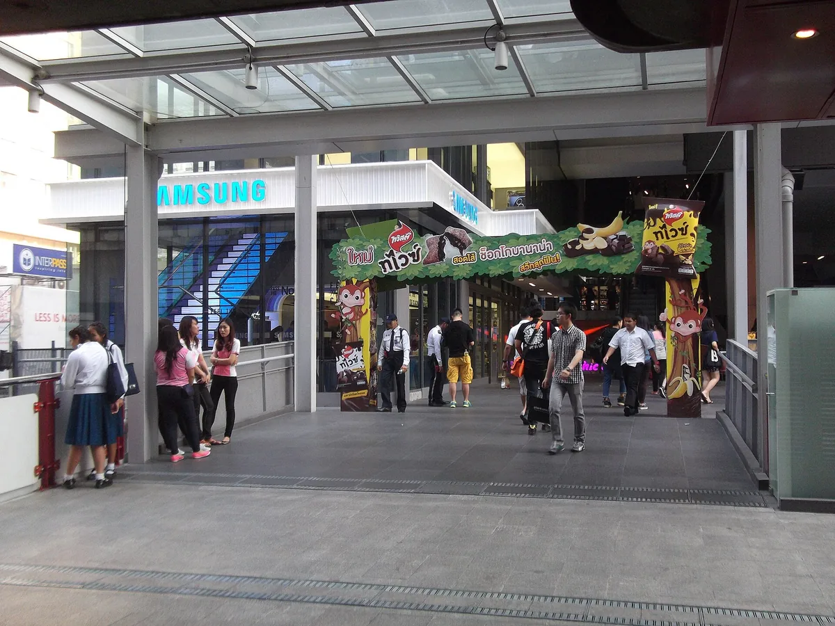 The Siam Square One entrance in Bangkok with passers by