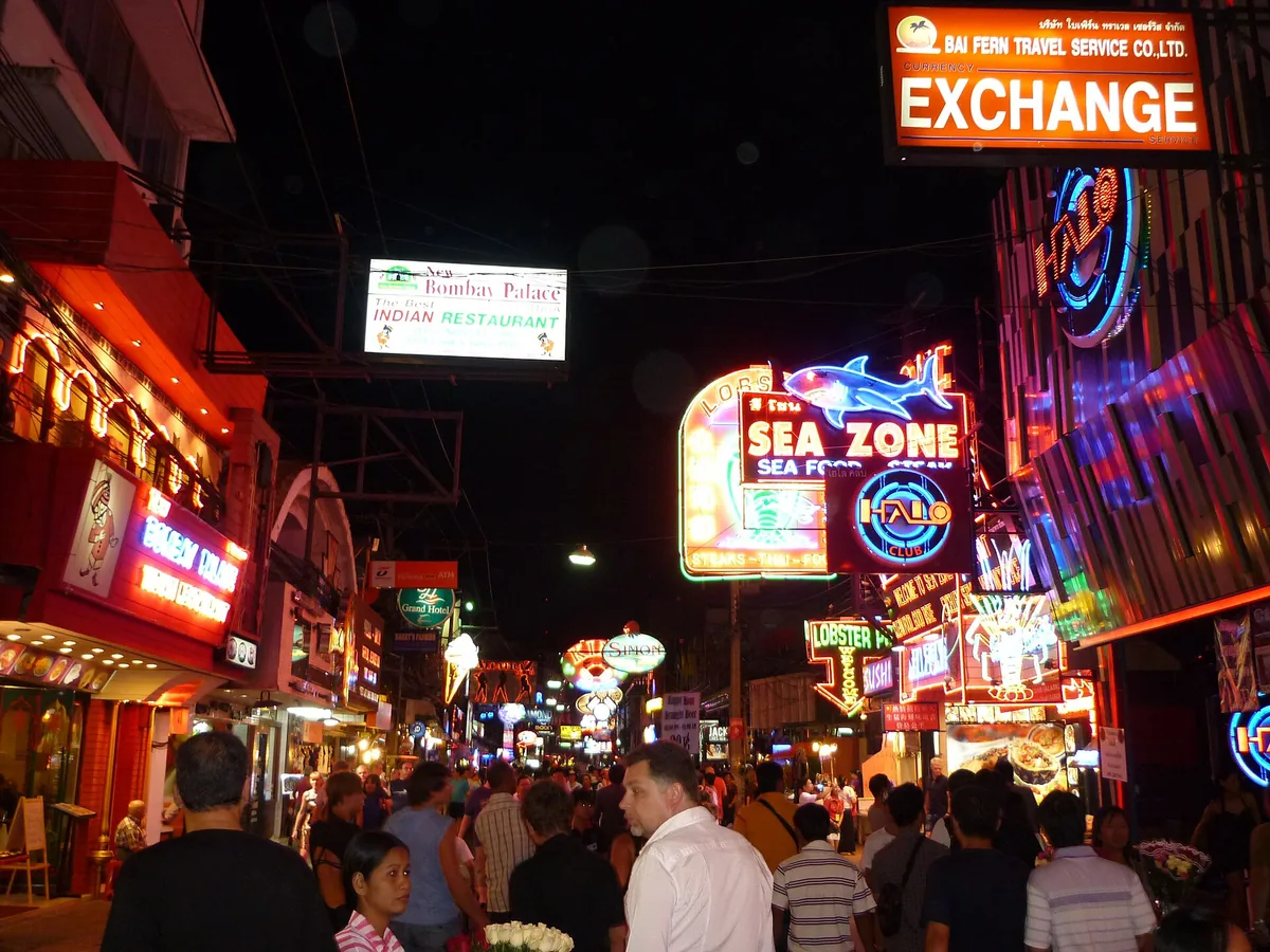 Neon signs and crowds on Walking Street in Pattaya at night