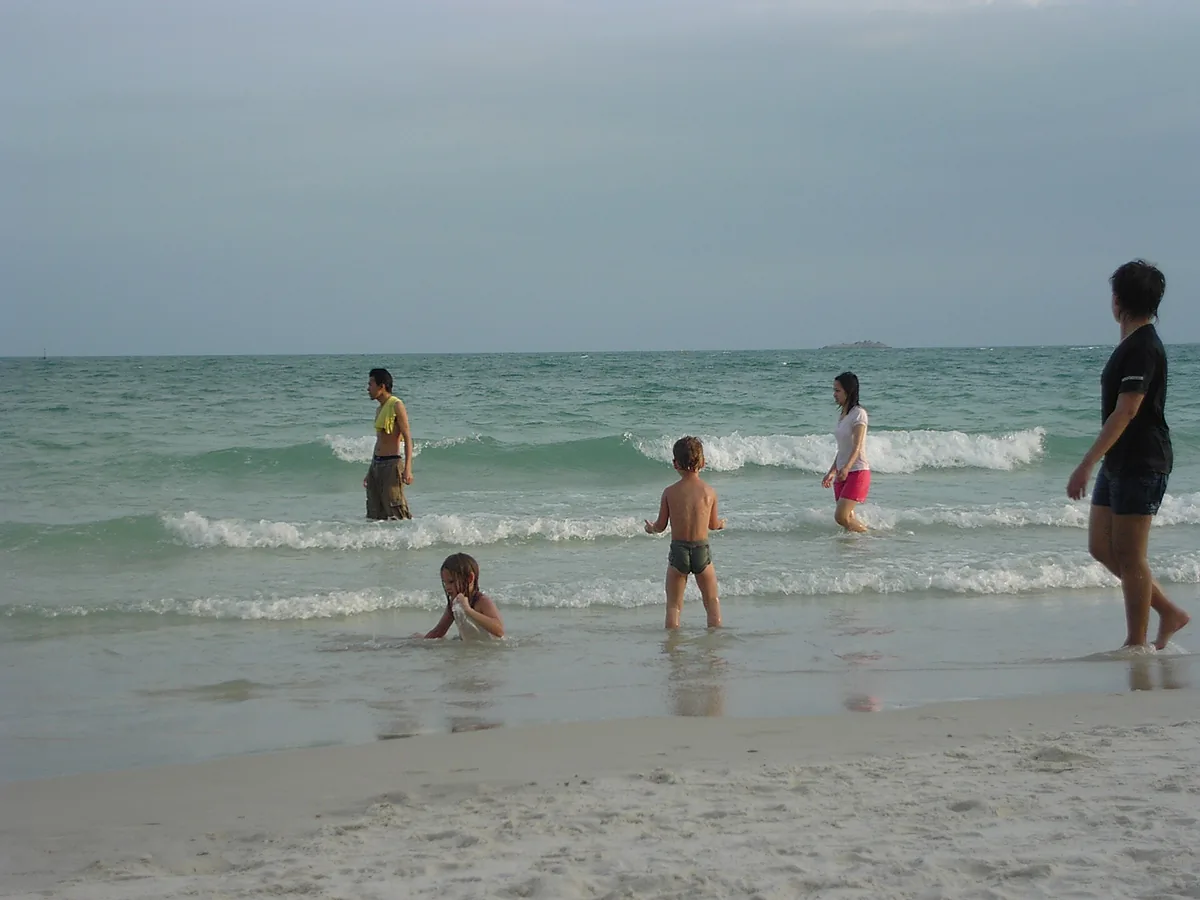 Bathers in the shallows at Sai Kaew beach on Koh Samet