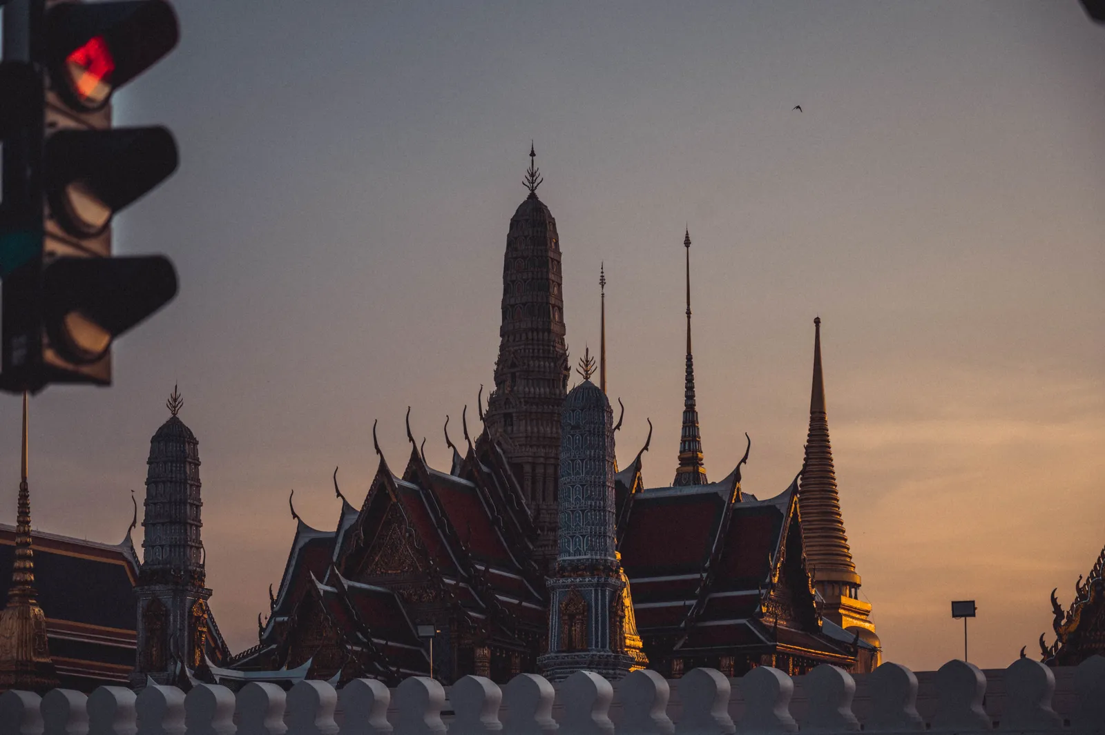 The rooftops and golden spires of a temple complex in Bangkok, Thailand