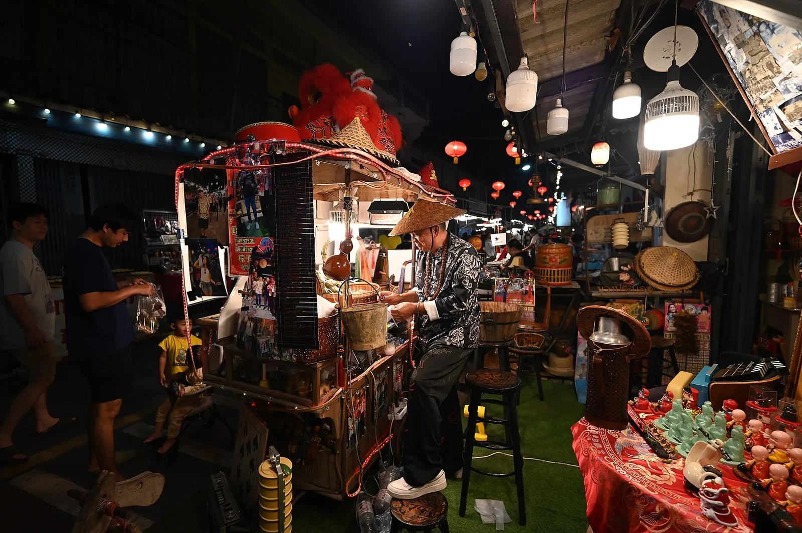 A night market stall lit up in the evening in Thailand