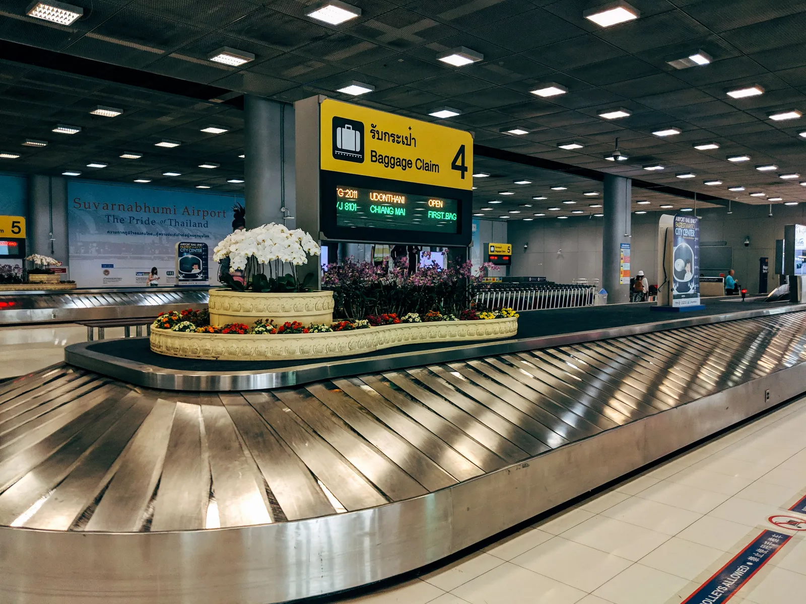 Mobile operator counters in an airport arrivals hall in Thailand